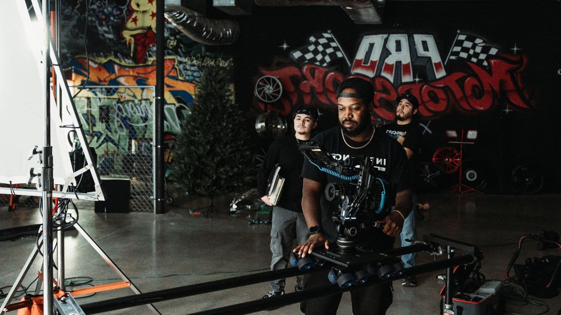 Influence Studios crew running a camera slider at a Pro Motocross shoot