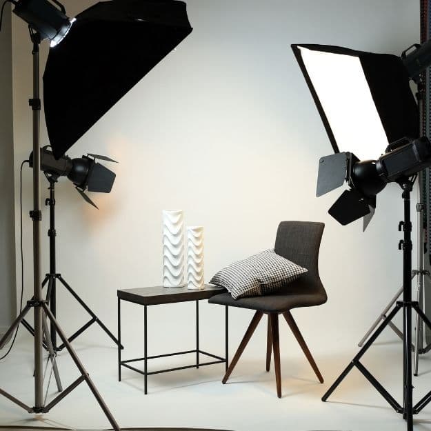 Portrait set lit with paired softboxes against a seamless backdrop